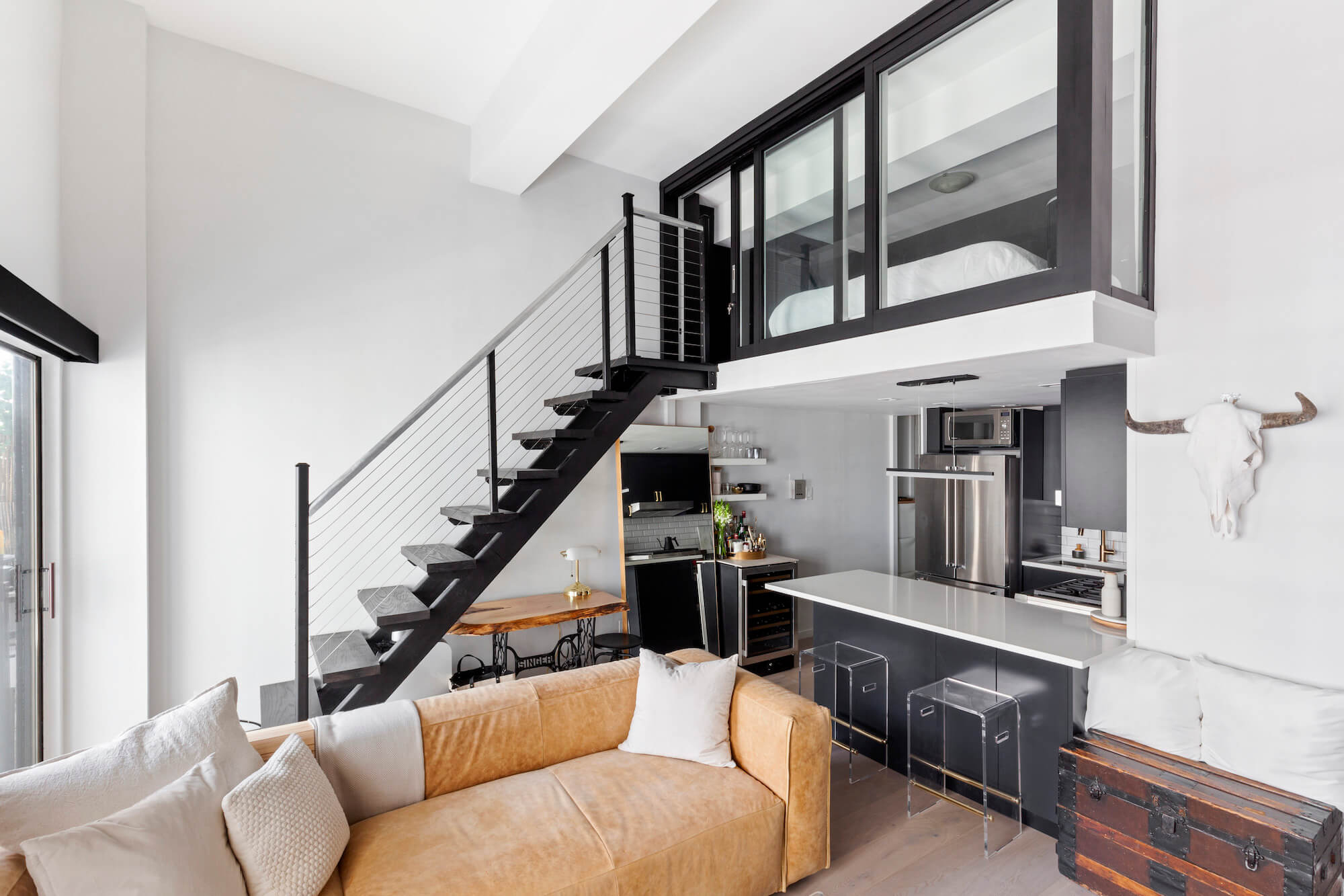 A Studio Loft And Balcony Check All The Boxes | Sweeten.com regarding Is a Loft Bed with a Desk Right for Your Child Discover the Lacey