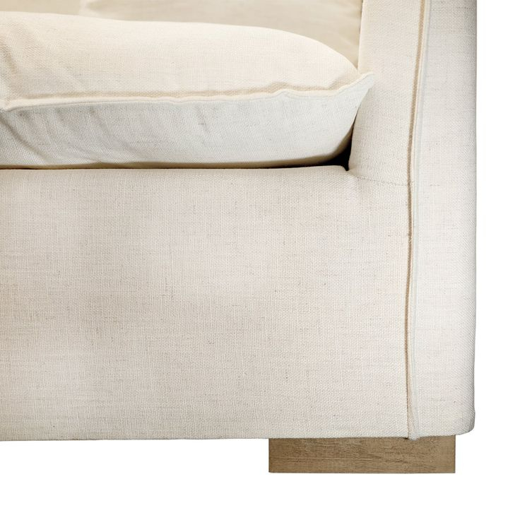 The Back End Of A White Couch With Two Pillows On It's Armrests regarding Unveiling the Allure of the La Rachelle Sofa in Icicle/Champagne