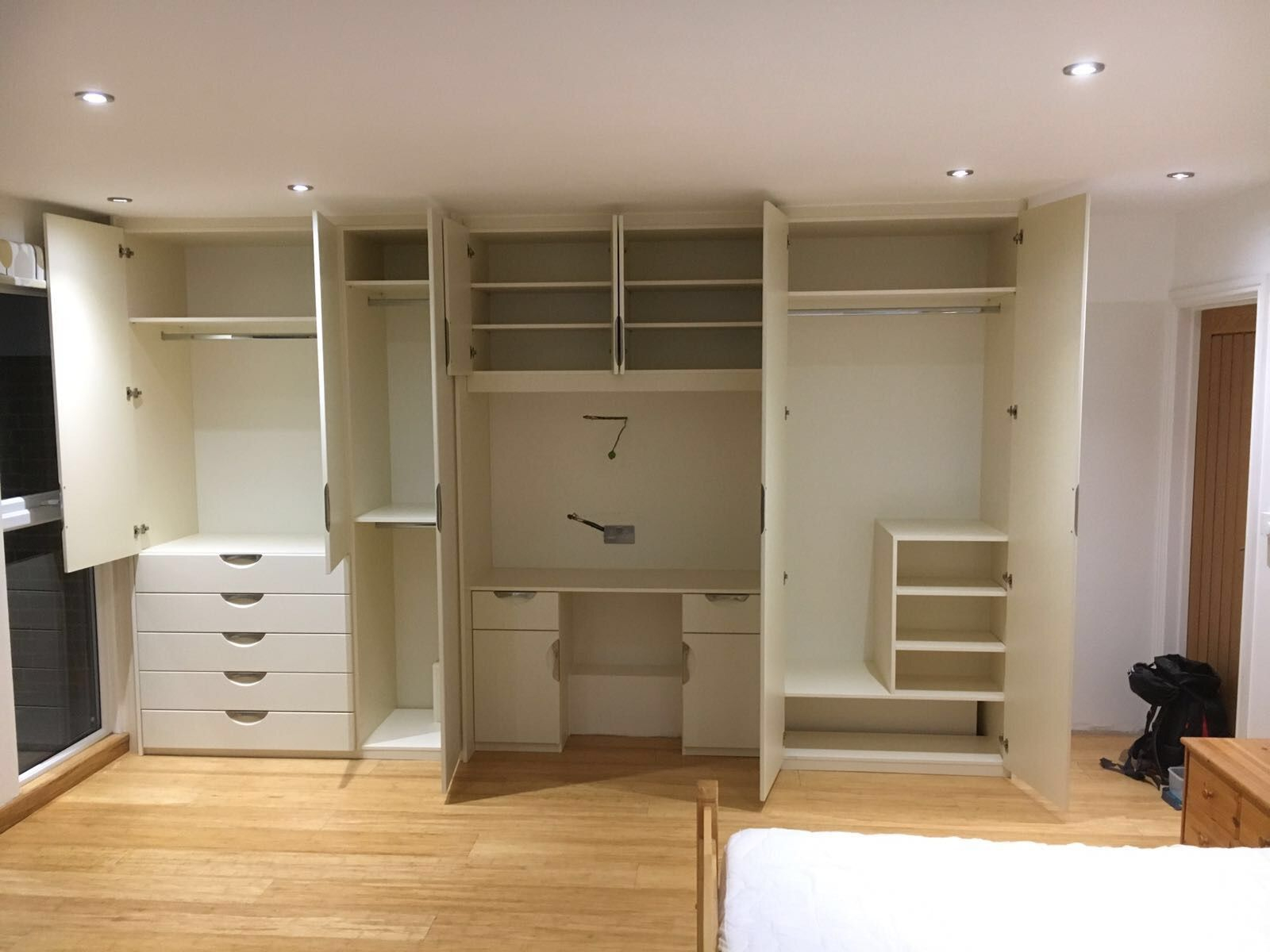 Look At The Storage In Here! It's Even Got A Little Dressing Table ... for Maximizing Space and Style with a 2-Piece Natural Wood Wardrobe Ensemble