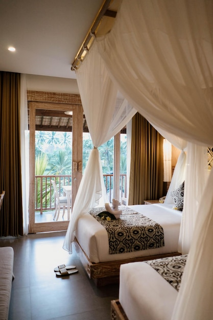 Creating Intimate Bedroom Atmosphere Using Canopy Bed and Balcony
