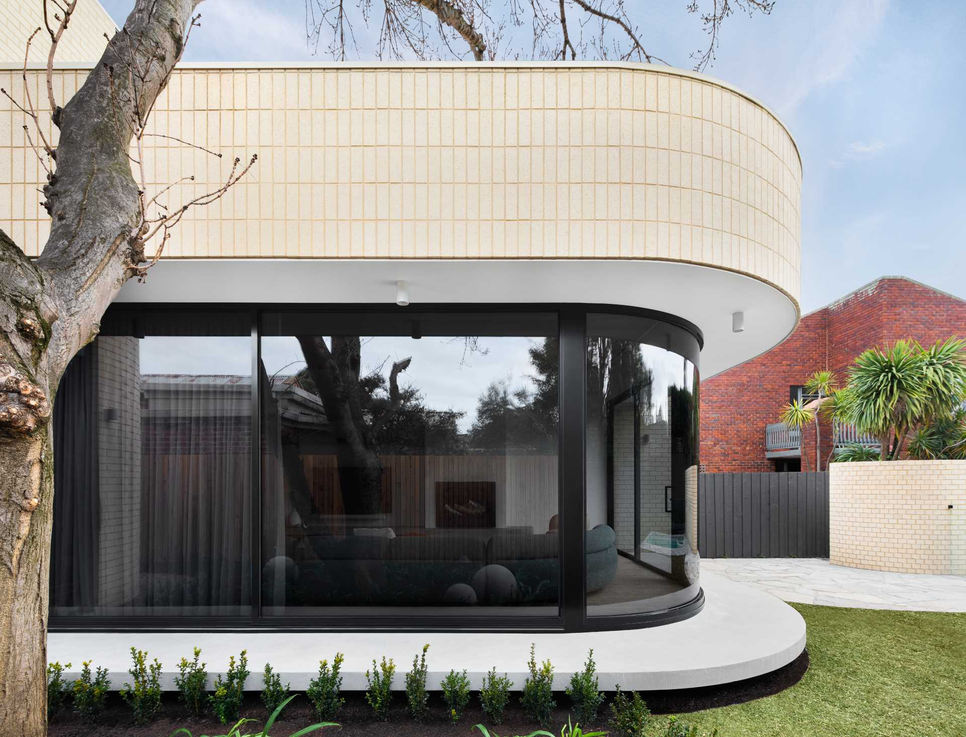A Curved Corner Softens The Space Inside This Home Extension ... in Balancing modern minimalism and soft curves in contemporary homes